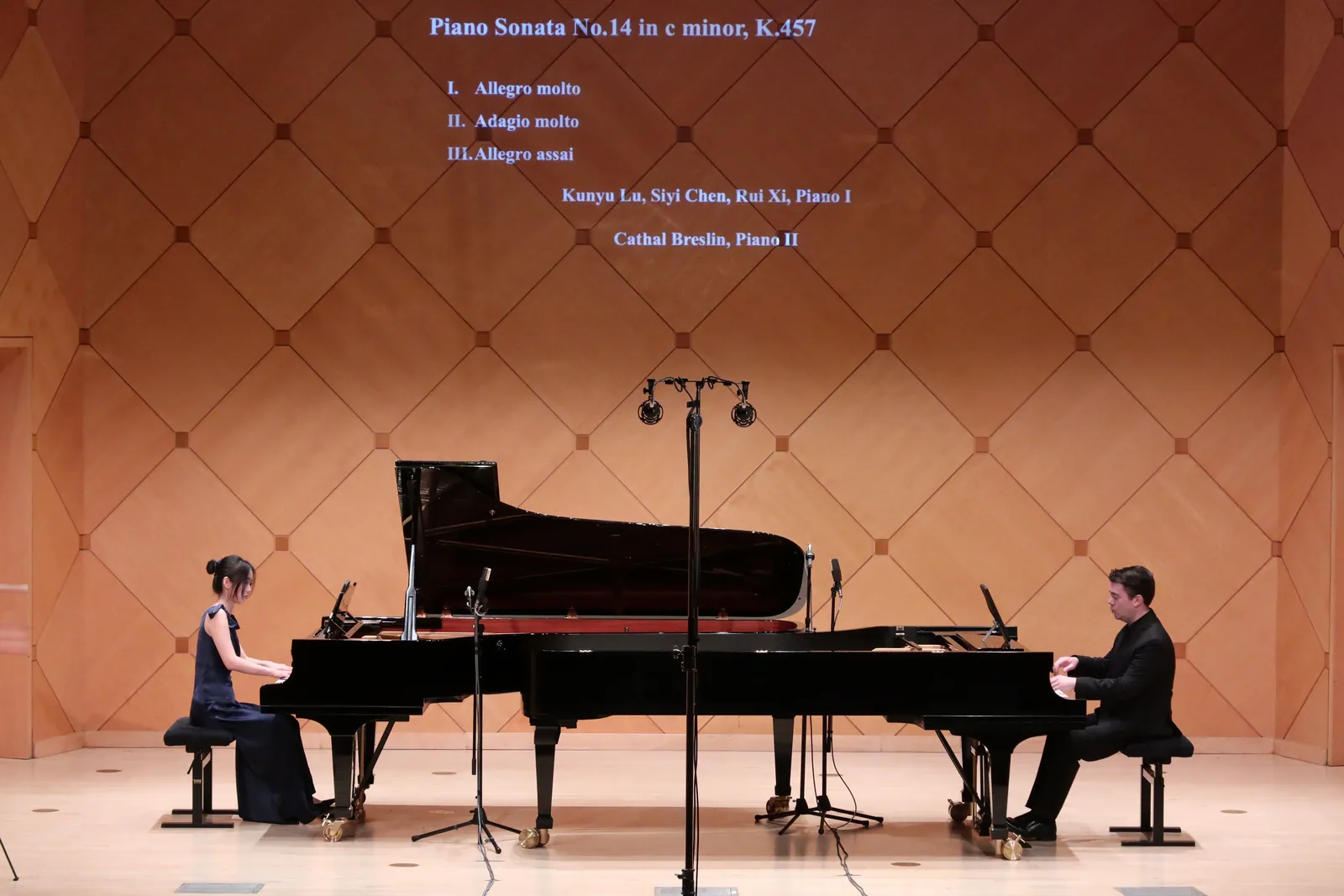 Rui Xi performing a piano duo recital