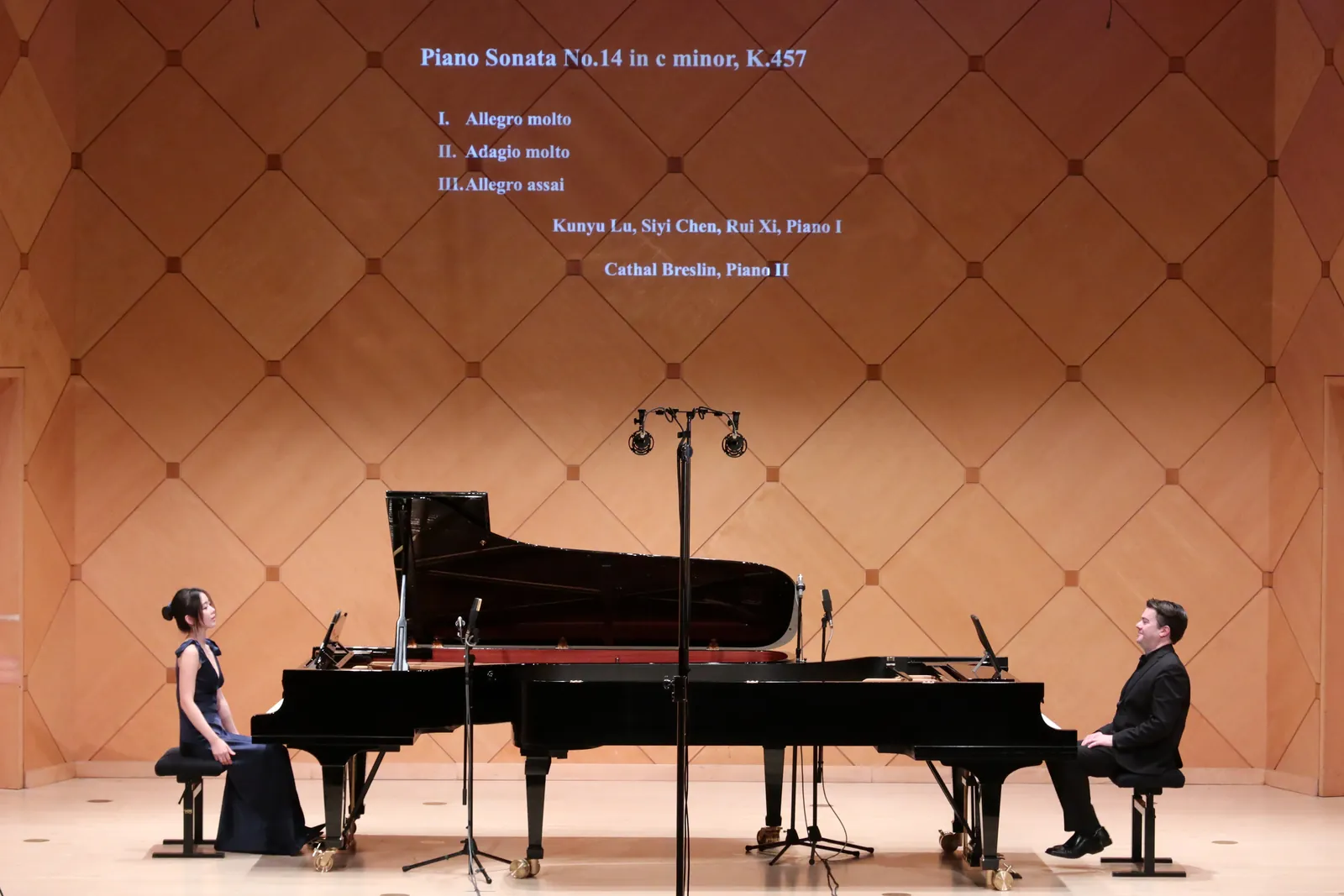 Rui Xi performing a piano duo in concert