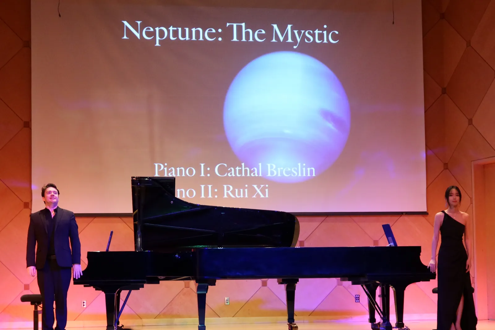 Rui Xi onstage during a piano performance presentation