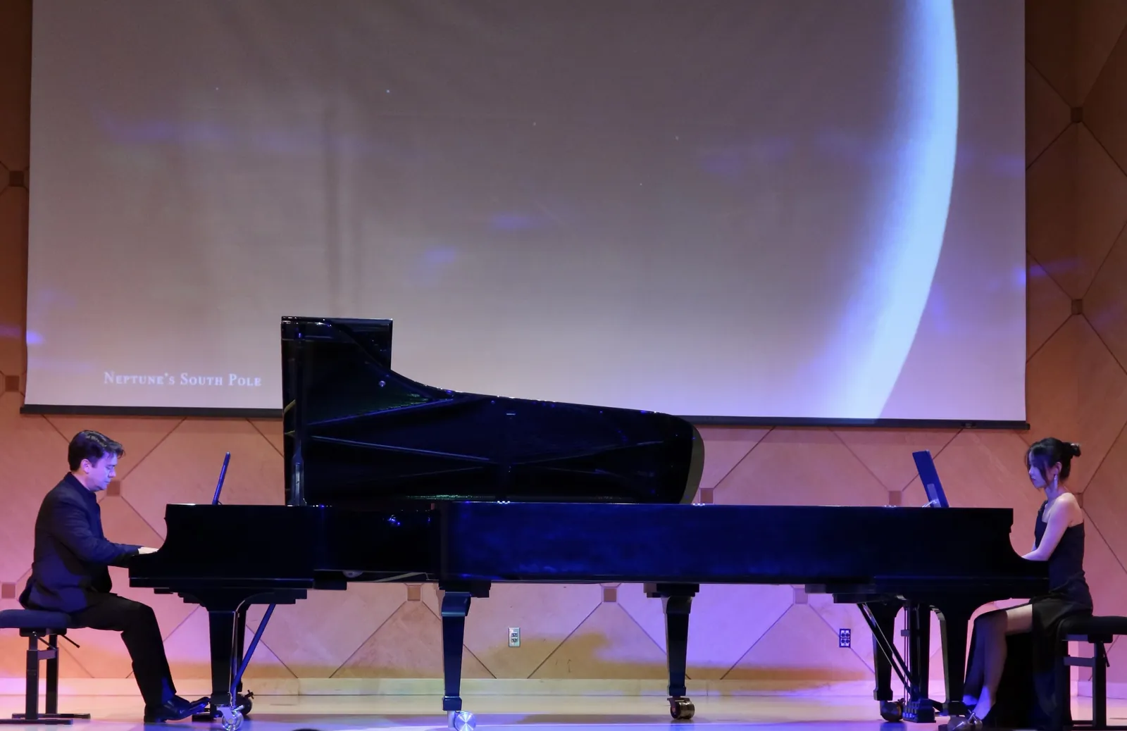 Rui Xi performing a two-piano concert onstage